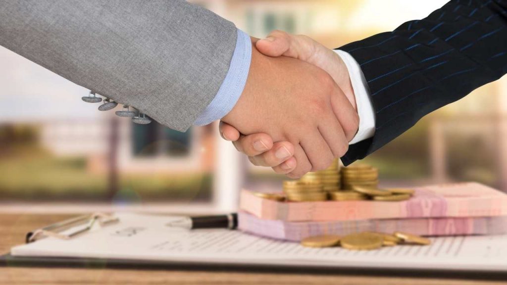 real estate investing handshake
