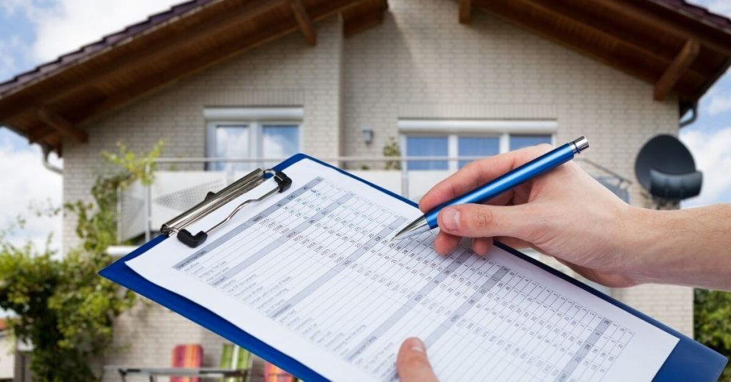 person completing an inspection checklist